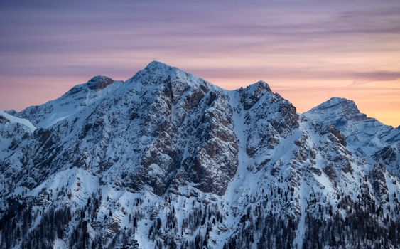 Captivating view of the snow-covered Dolomites at sunset, showcasing nature's beauty.