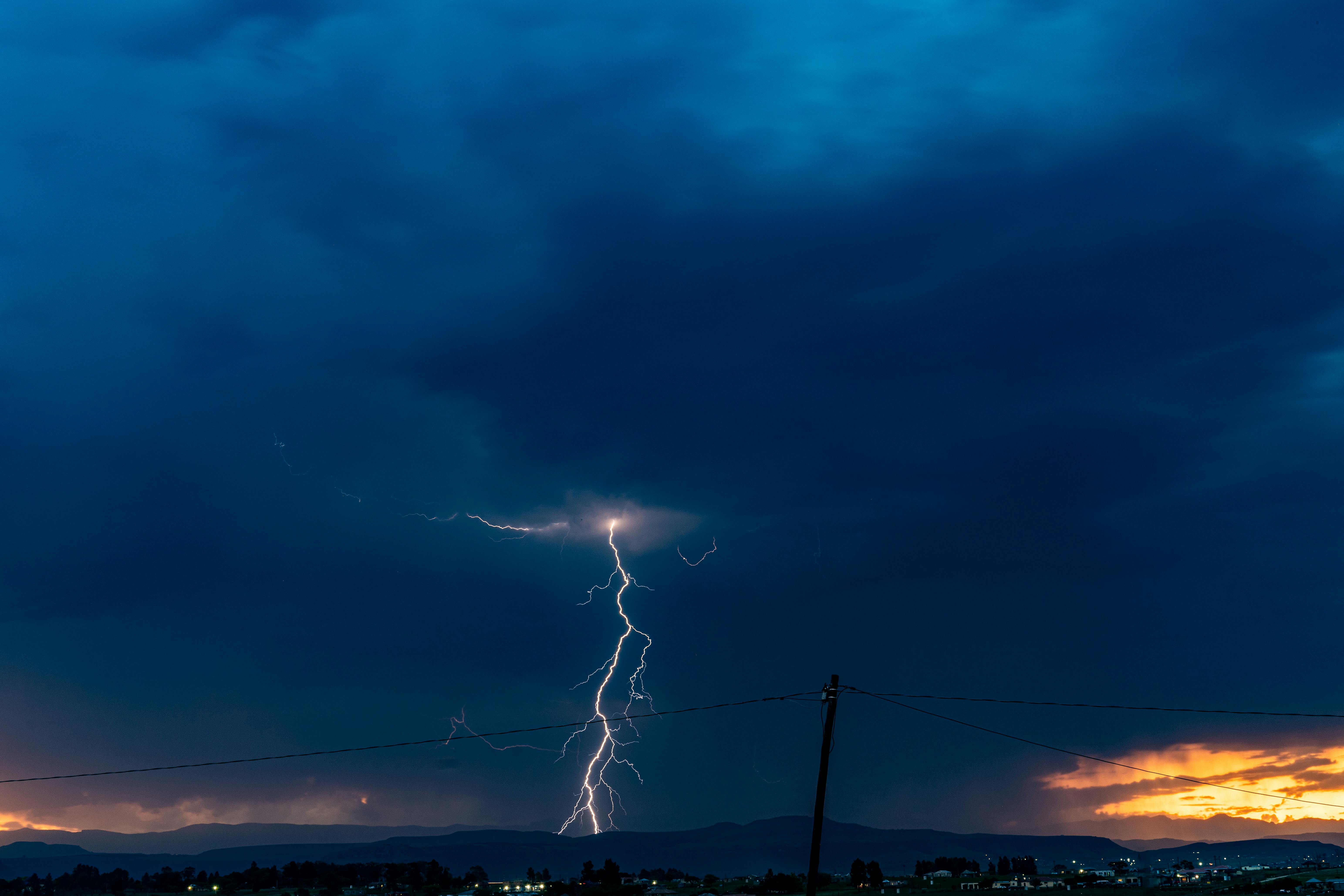 A breathtaking lightning strike during a thunderstorm over Ephangweni, South Africa, showcasing nature's power.