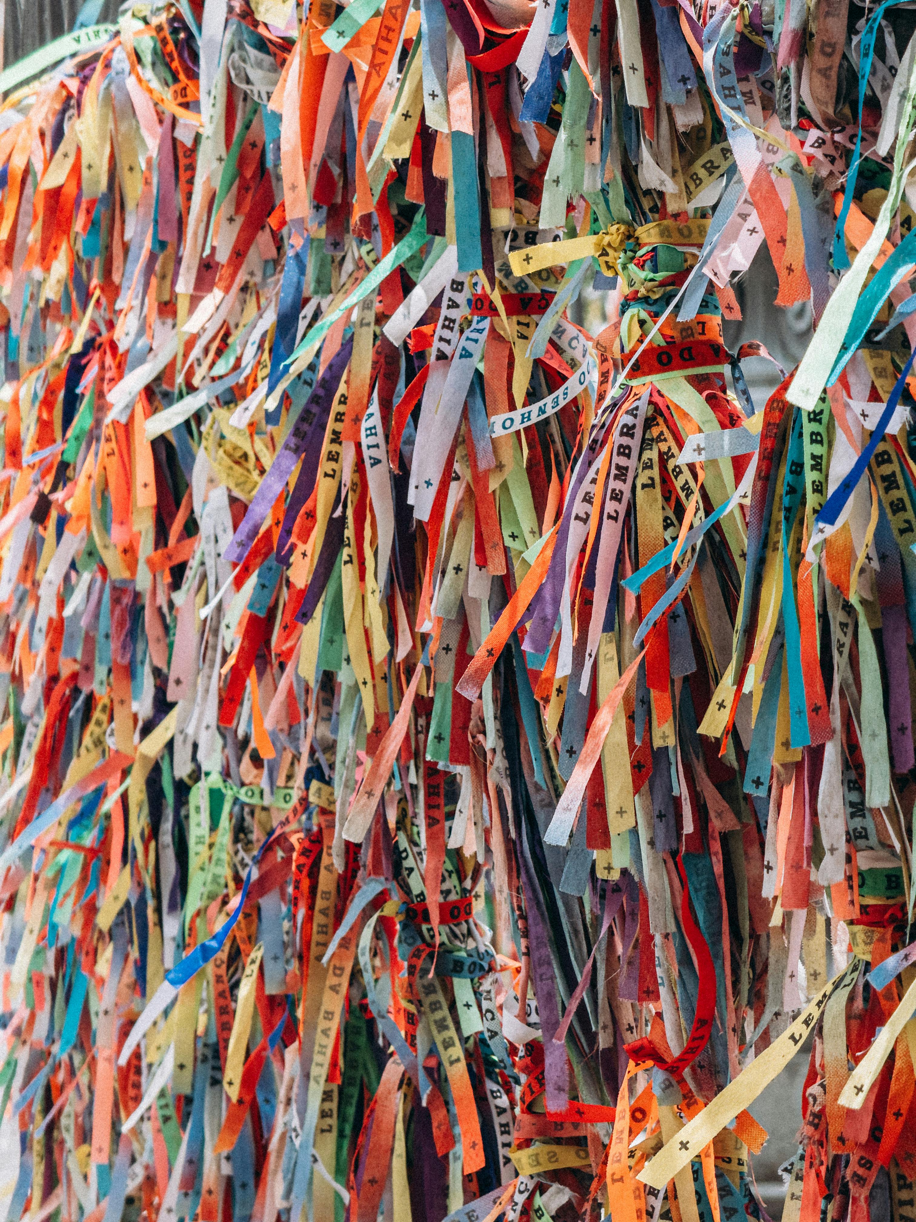 Vibrant Brazilian wish ribbons tied together in Salvador, Brazil, symbolizing hope and faith.