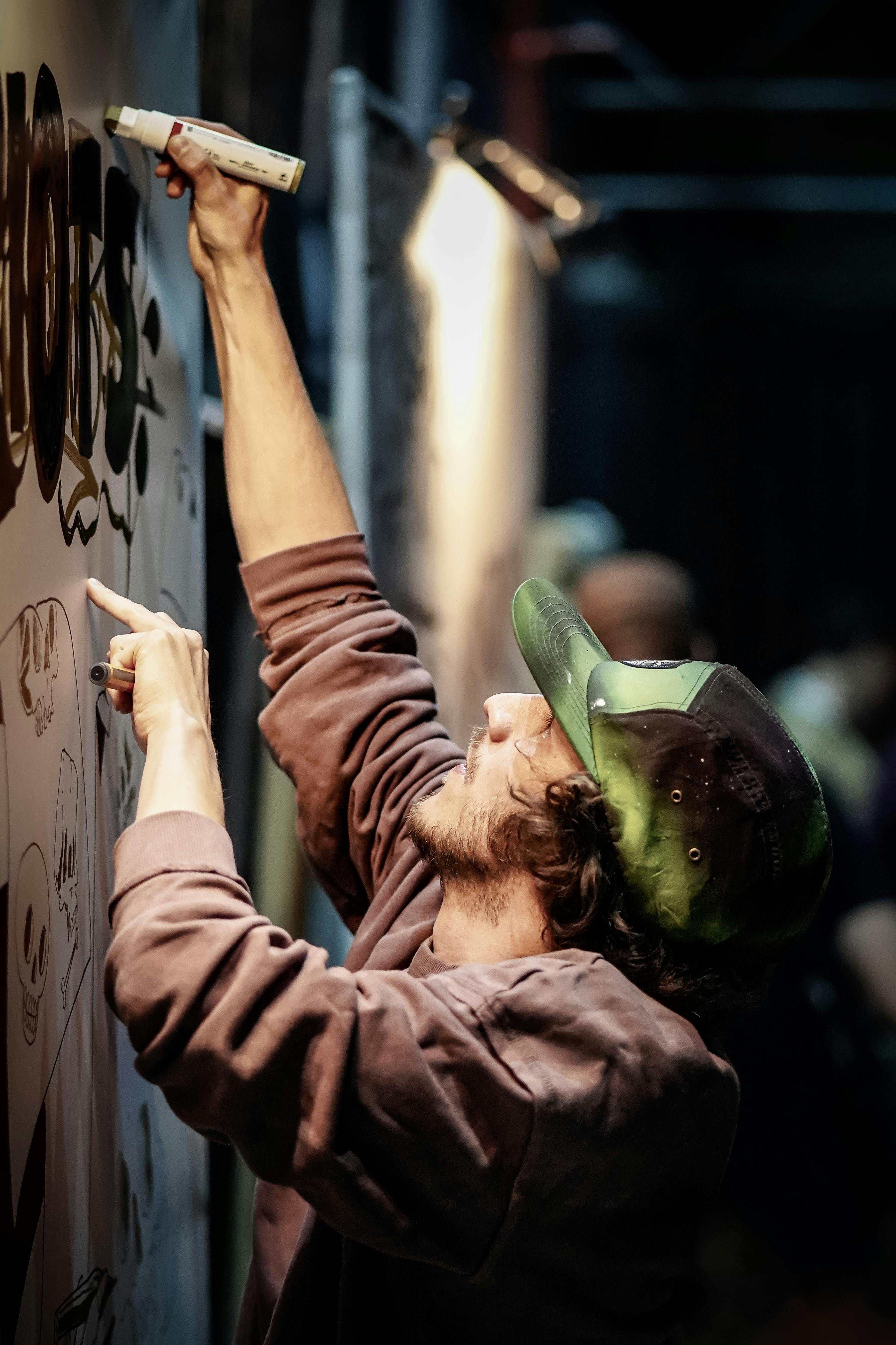 street artist creating an urban mural in berlin