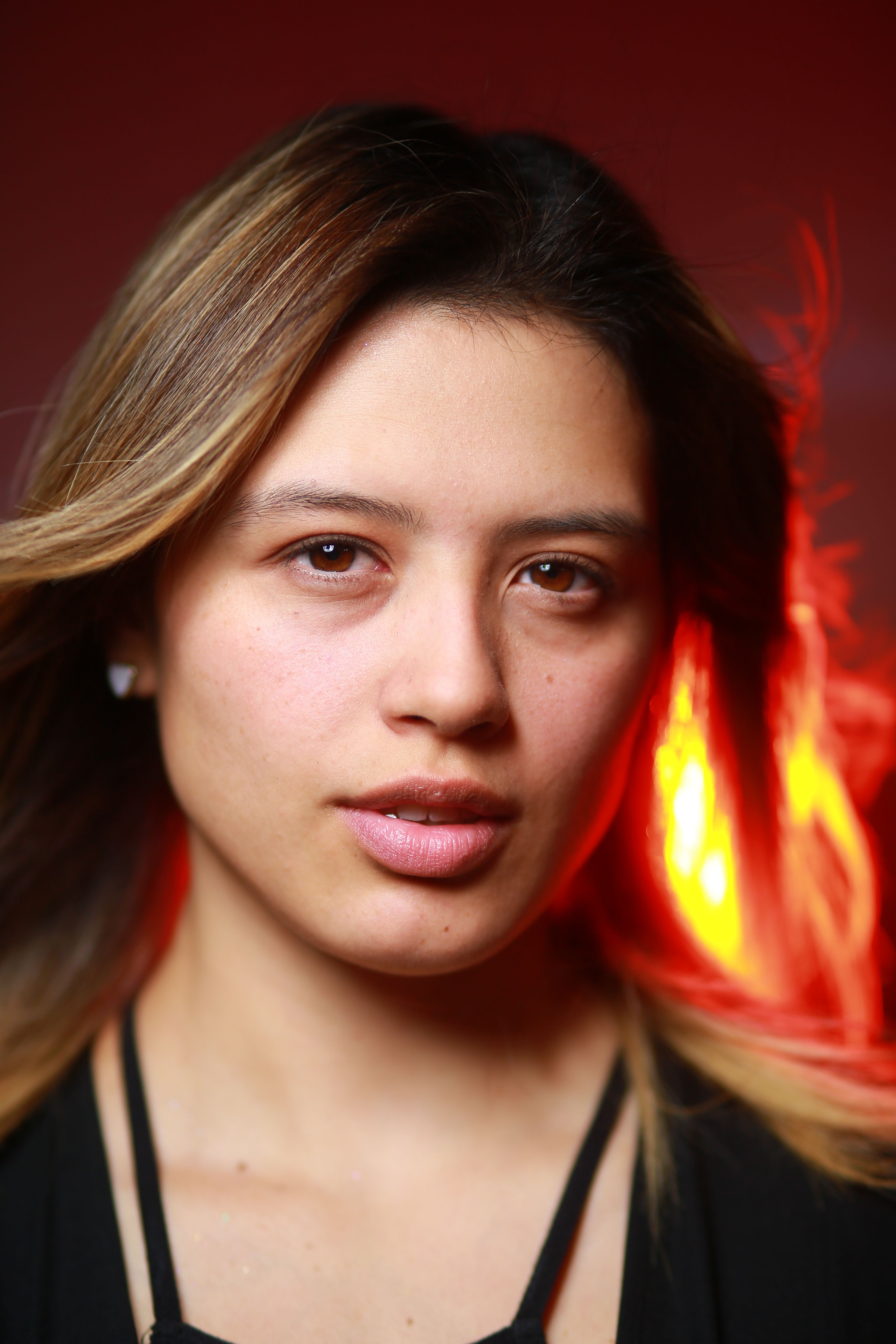 Portrait of a Woman with Vibrant Background · Free Stock Photo