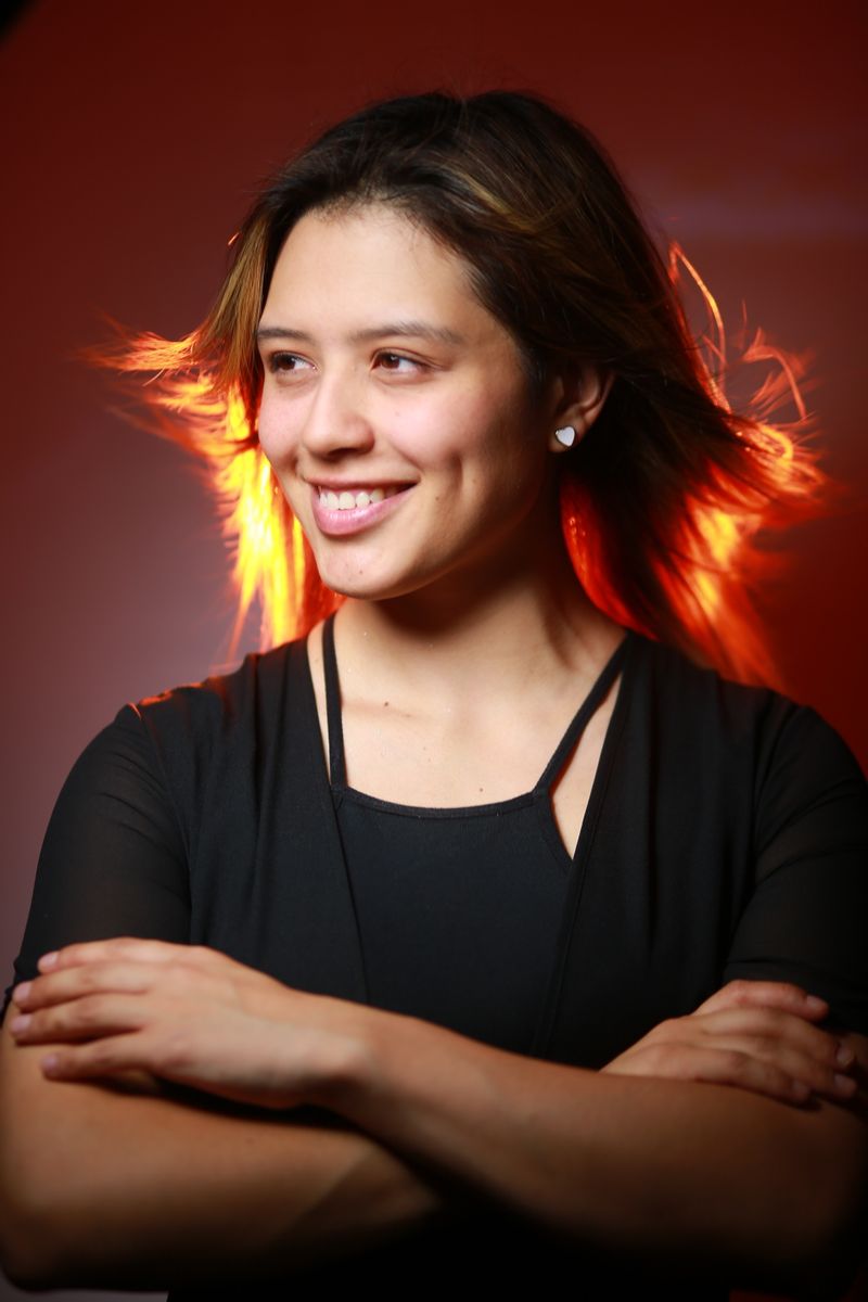 Confident Latina woman smiling