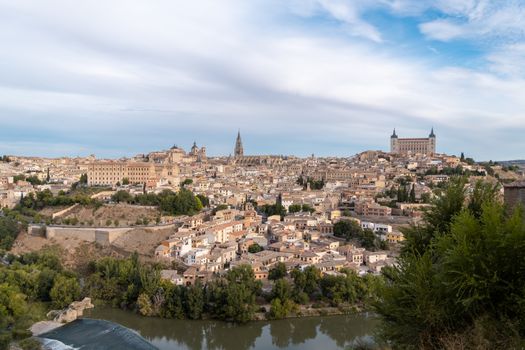 Discover the breathtaking aerial view of Toledo, showcasing its historic architecture and Tajo River.