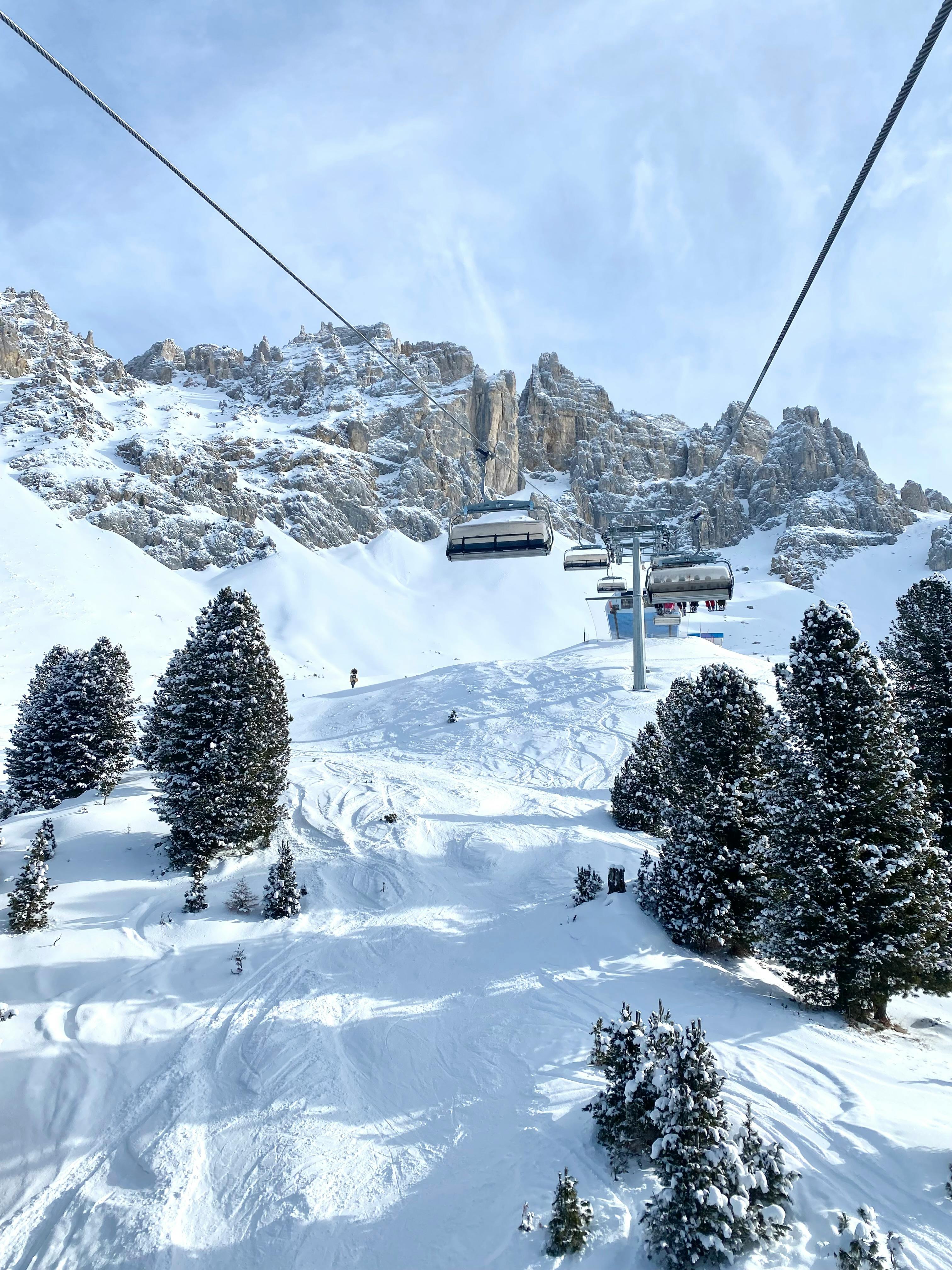 Prescription Goggle Inserts - Captivating winter scene with ski lift in Italian Alps' snow-covered mountains.