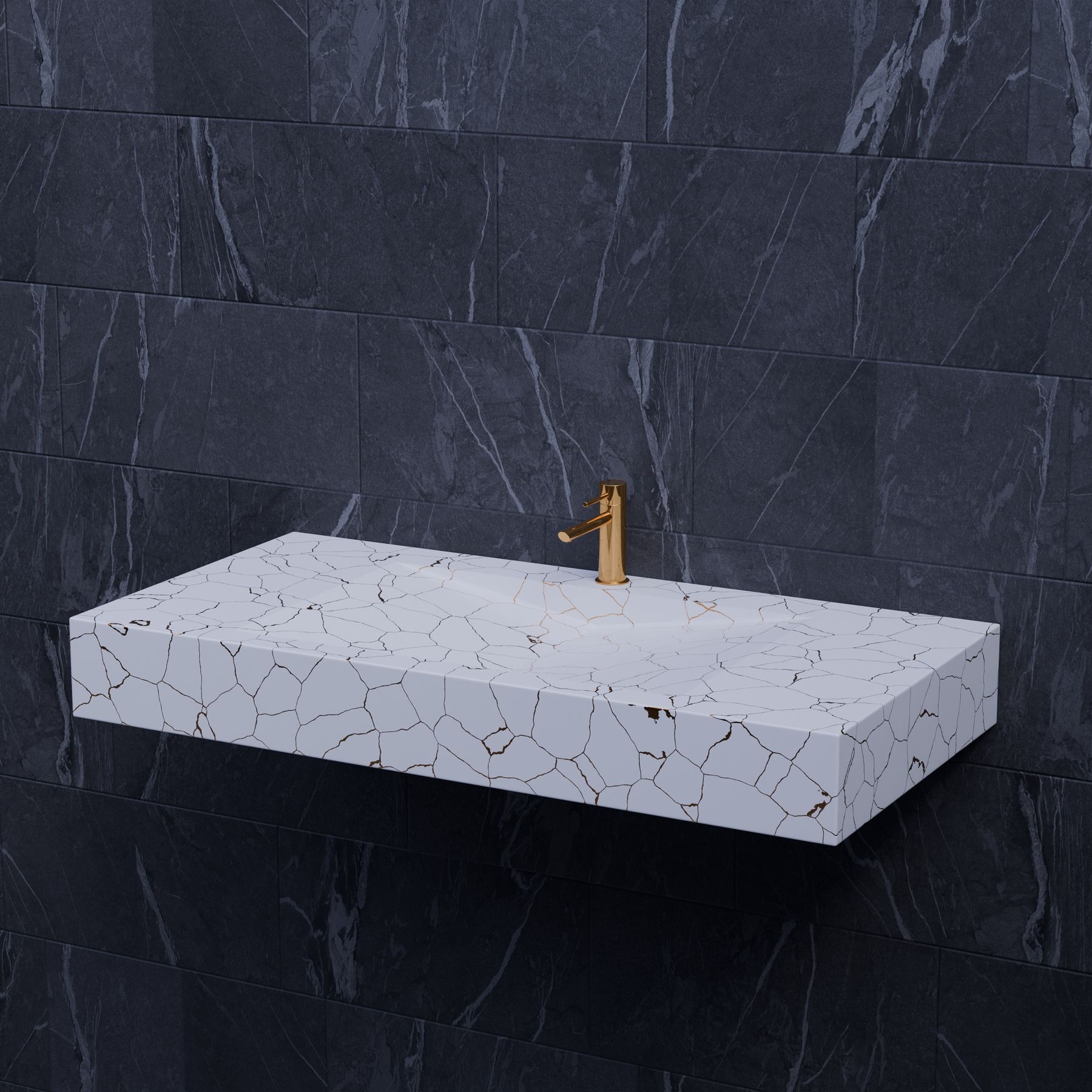 Marble bathroom sink with gold faucet against dark stone tile
