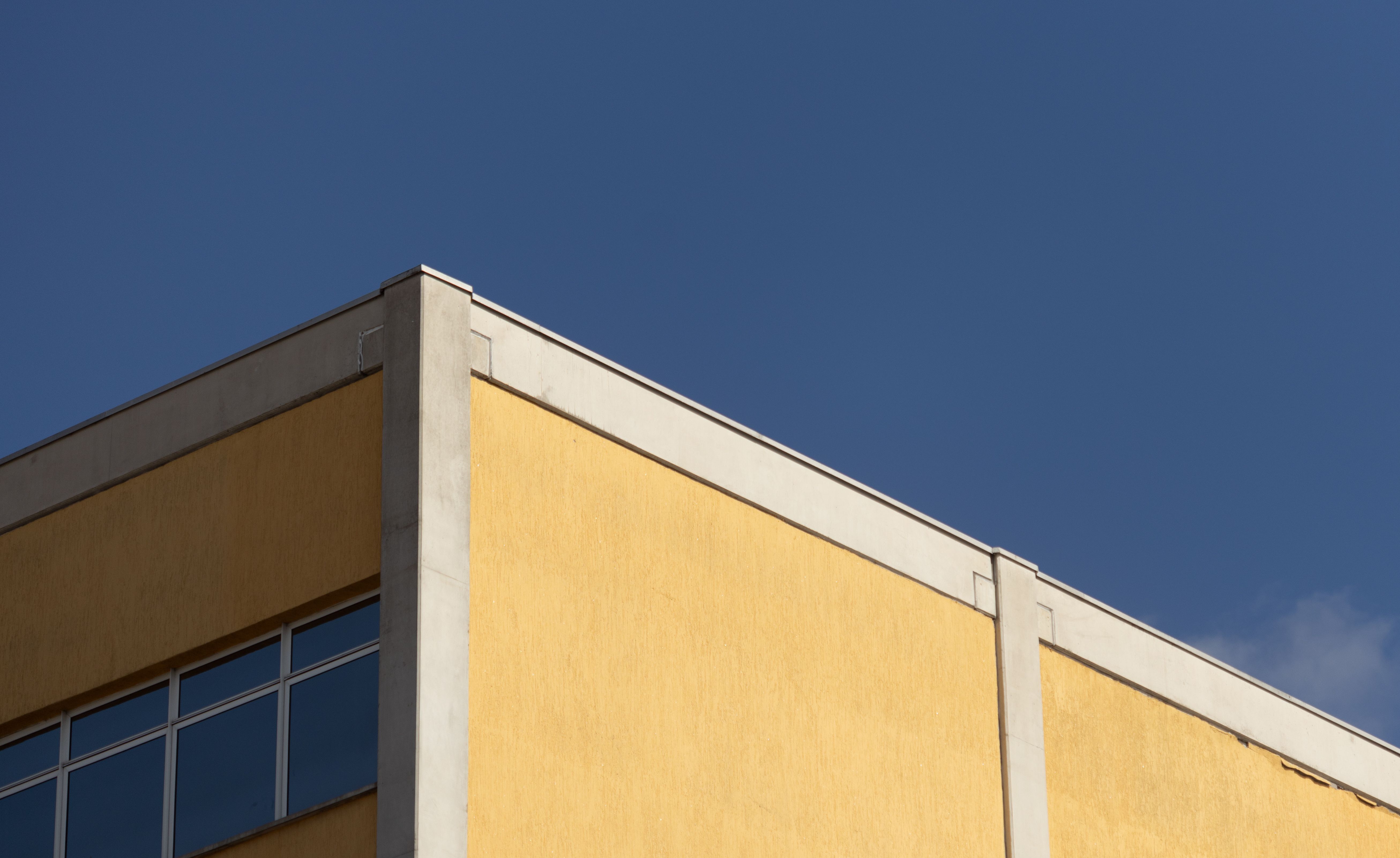 Minimalist Corner of Modern Building Under Blue Sky · Free Stock Photo