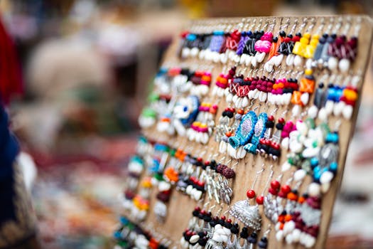 Vibrant handmade jewelry on display at a lively Indian market.