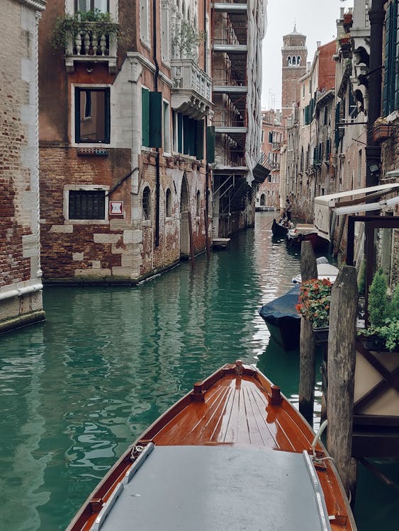 Free Brown Boat Along The Canals Of Venice Stock Photo