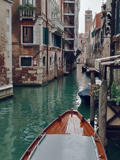 Free Explore the charm of Venetian canals with historic architecture and gondolas Stock Photo