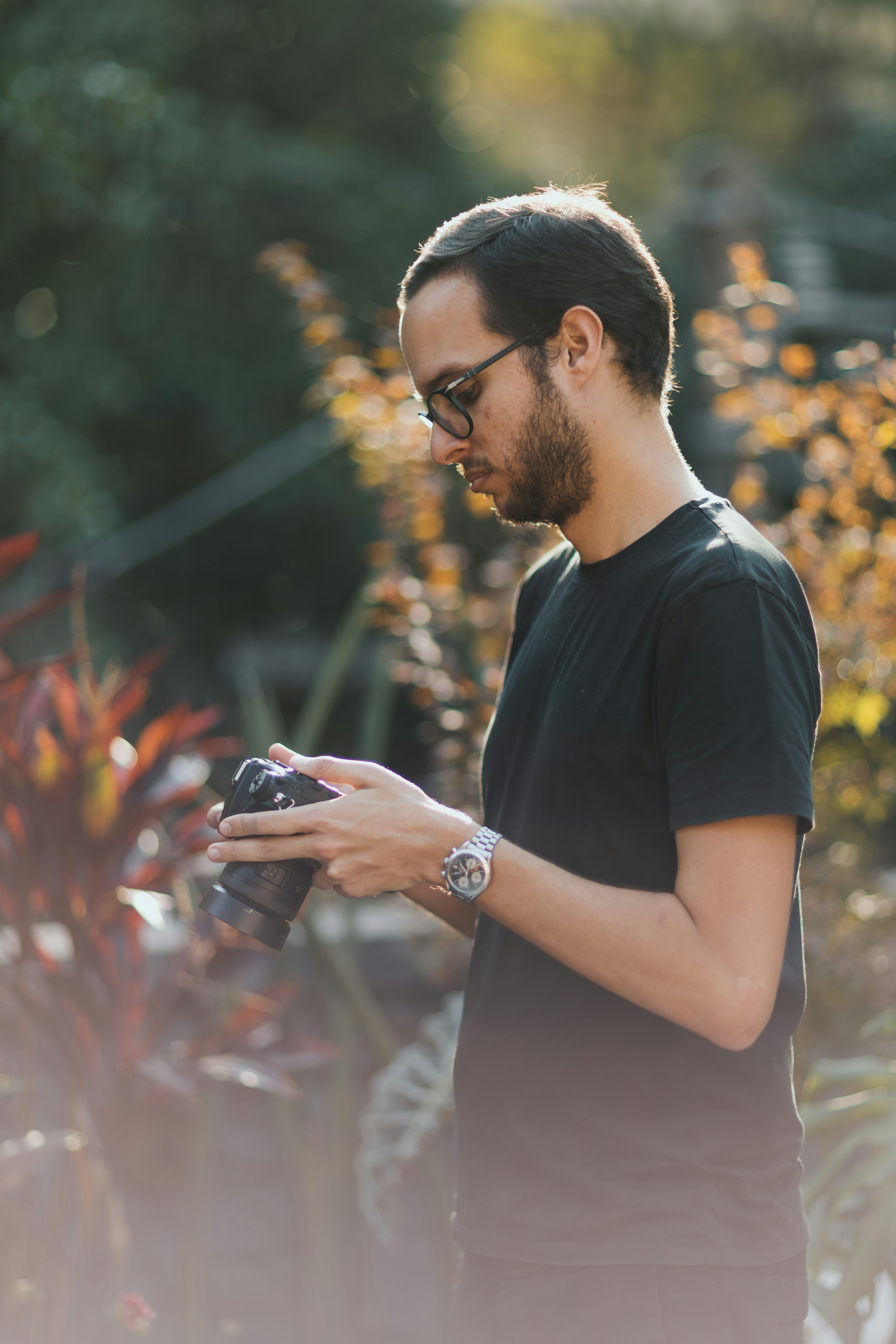 outdoor photographer reviewing shot in garden