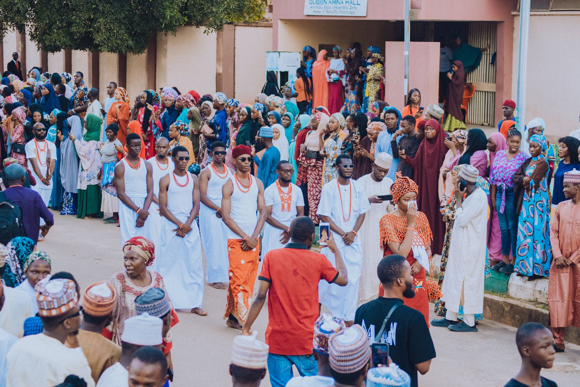 A lively parade showcasing traditional Nigerian attire in Kaduna, Nigeria.