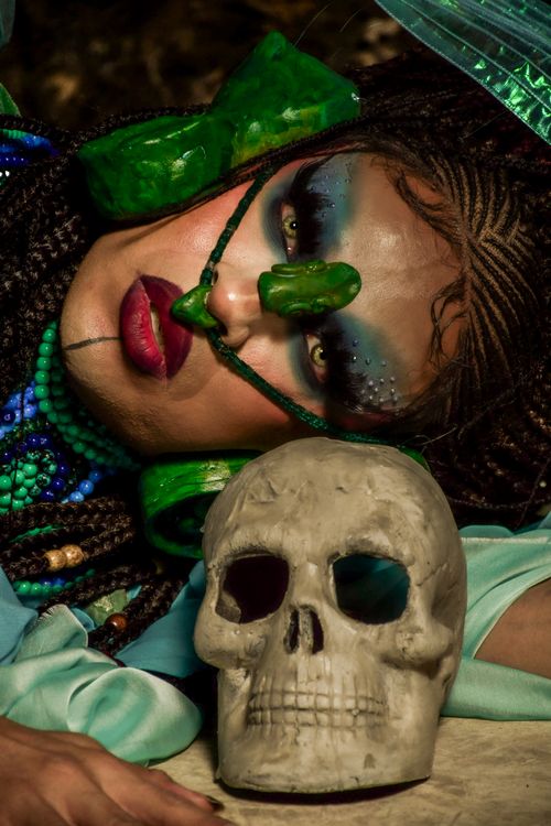 Free Vibrant makeup portrait featuring a skull, with intense dramatic flair. Stock Photo