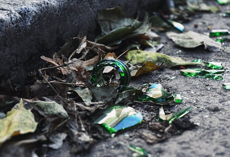 Broken Glass Bottle On The Sidewalk