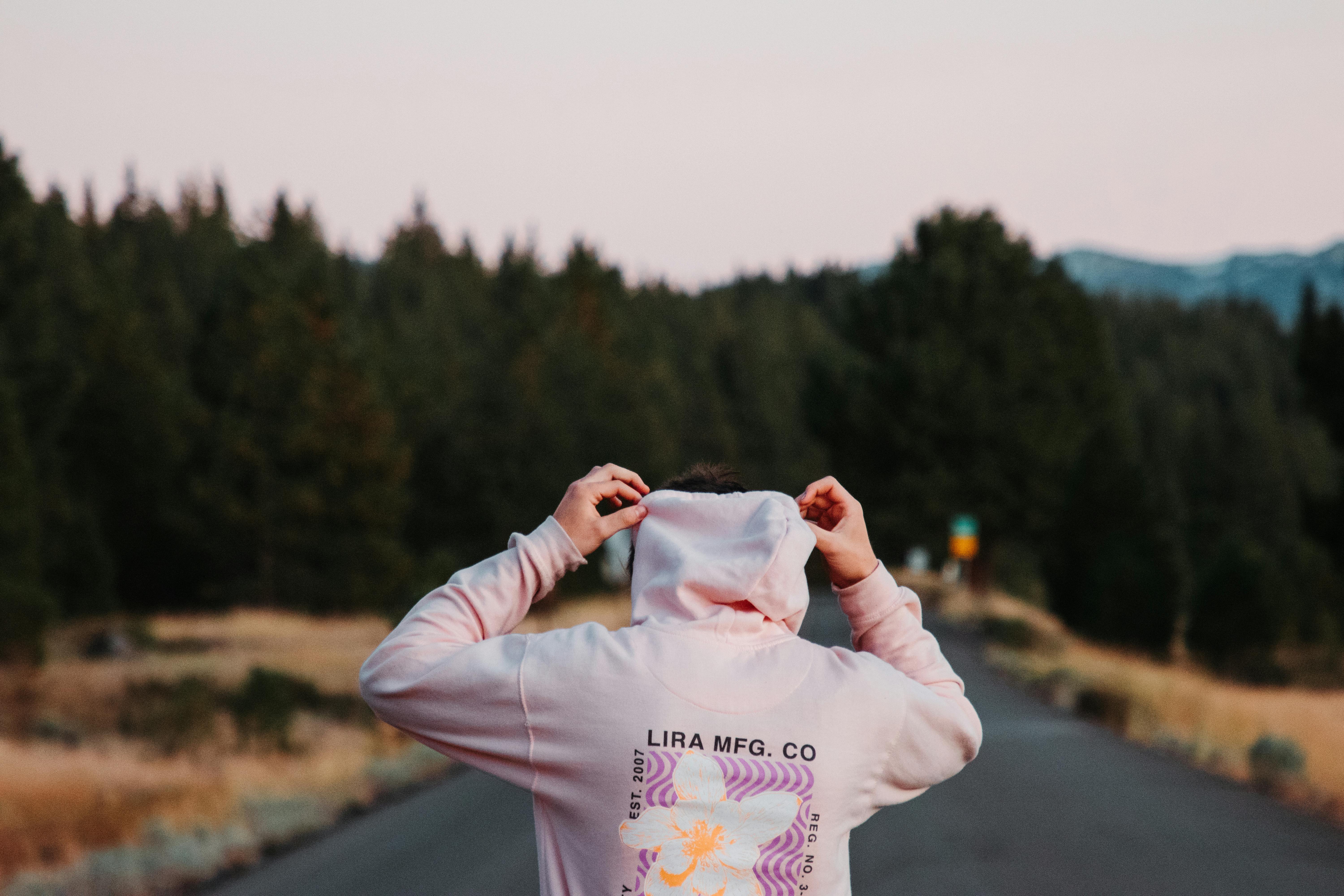 back view of a person in pink hoodie