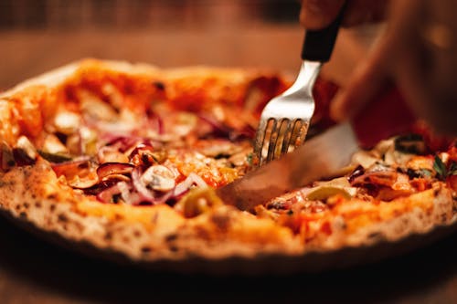 Close-up Of A Baked Pie Being Sliced