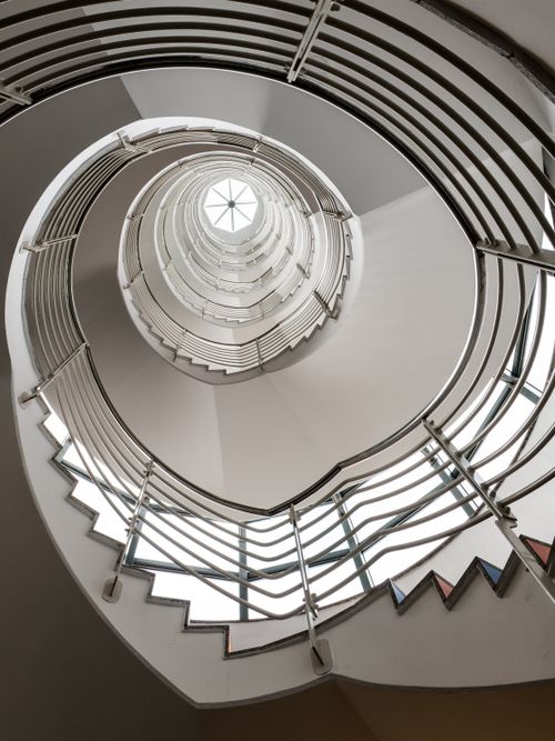 Free Elegant spiral staircase with geometric lines in Hamburg office building. Stock Photo