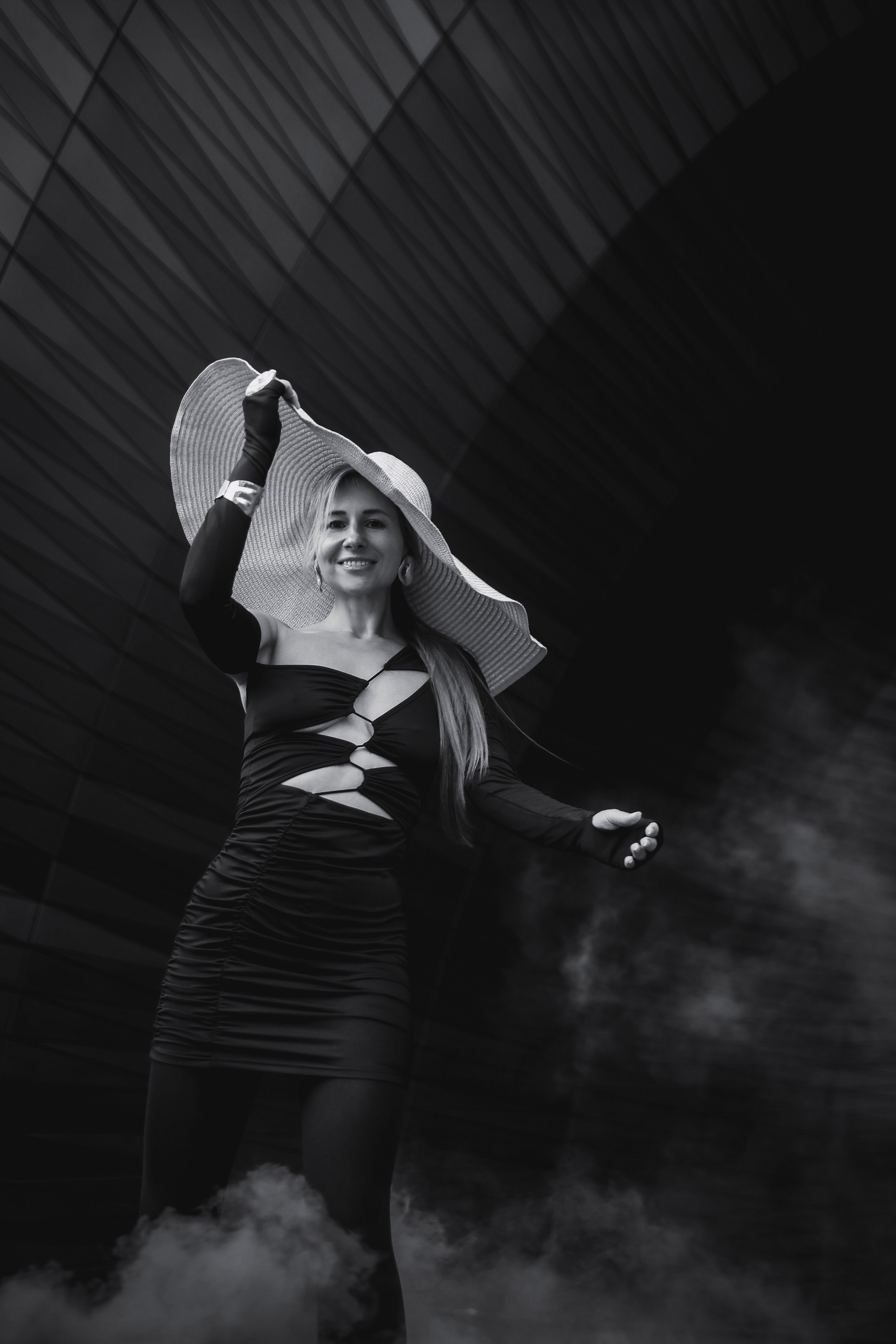 Elegant Woman in Black Dress with Large Hat · Free Stock Photo