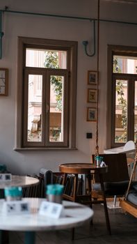 Warm and inviting café interior in İstanbul with natural light and stylish decor.
