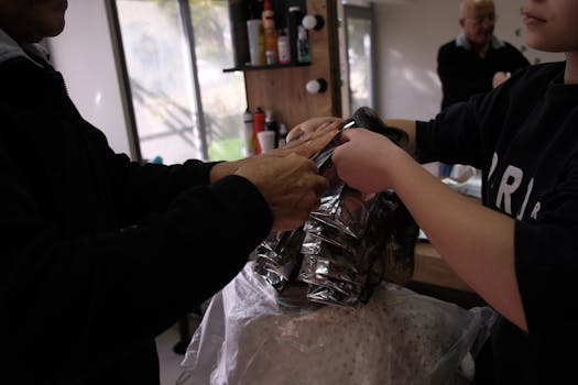 Hair coloring process at a salon in İzmir, Türkiye, showcasing professional techniques.
