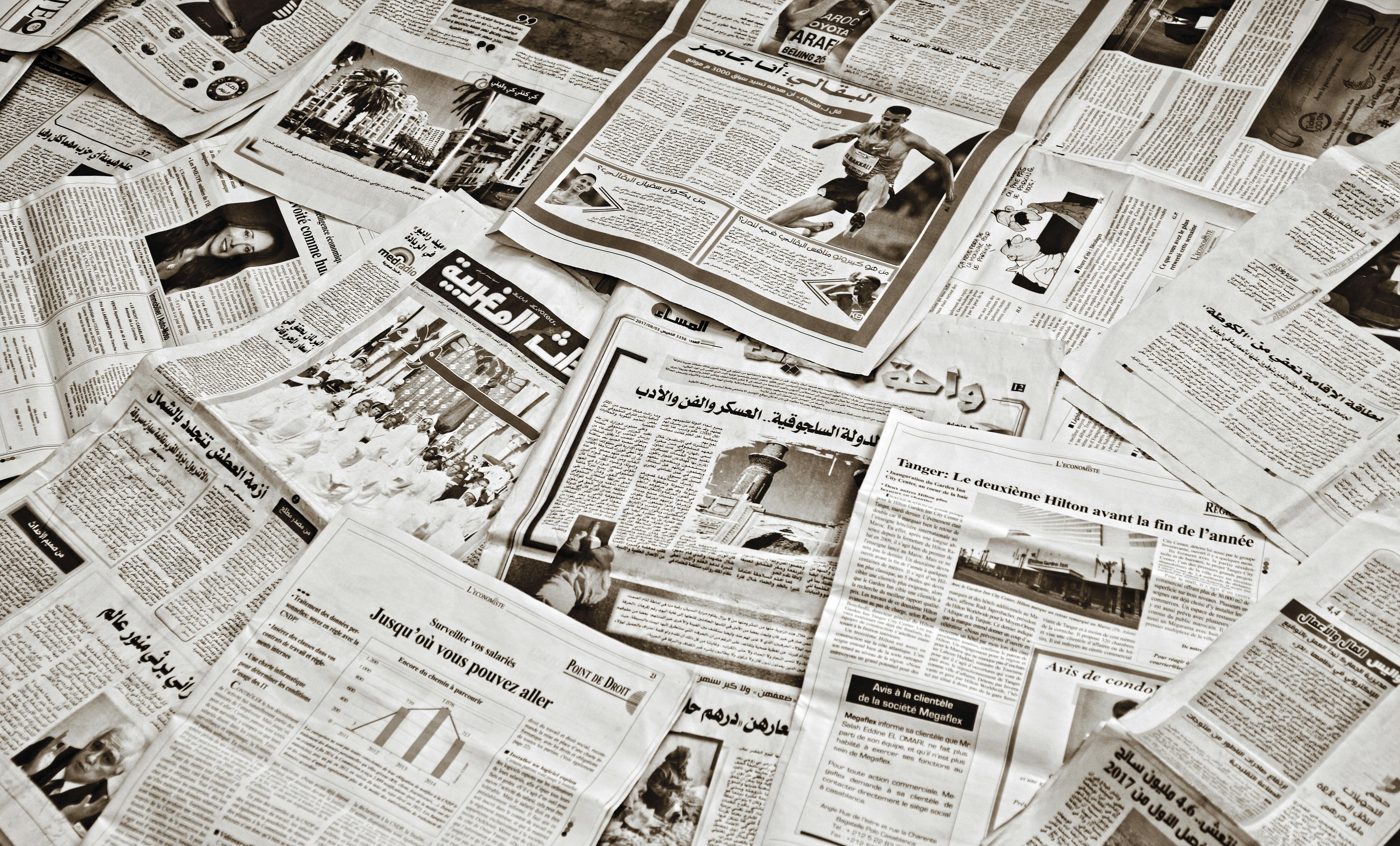 scattered arabic newspapers display