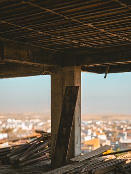 Rustic construction site with cityscape view, perfect for urban development themes.