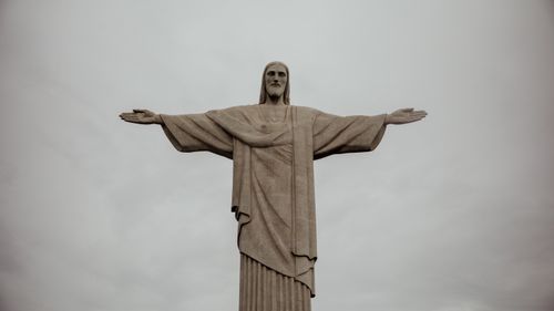 Free Christ the Redeemer statue in Rio de Janeiro, iconic symbol in overcast weather. Stock Photo