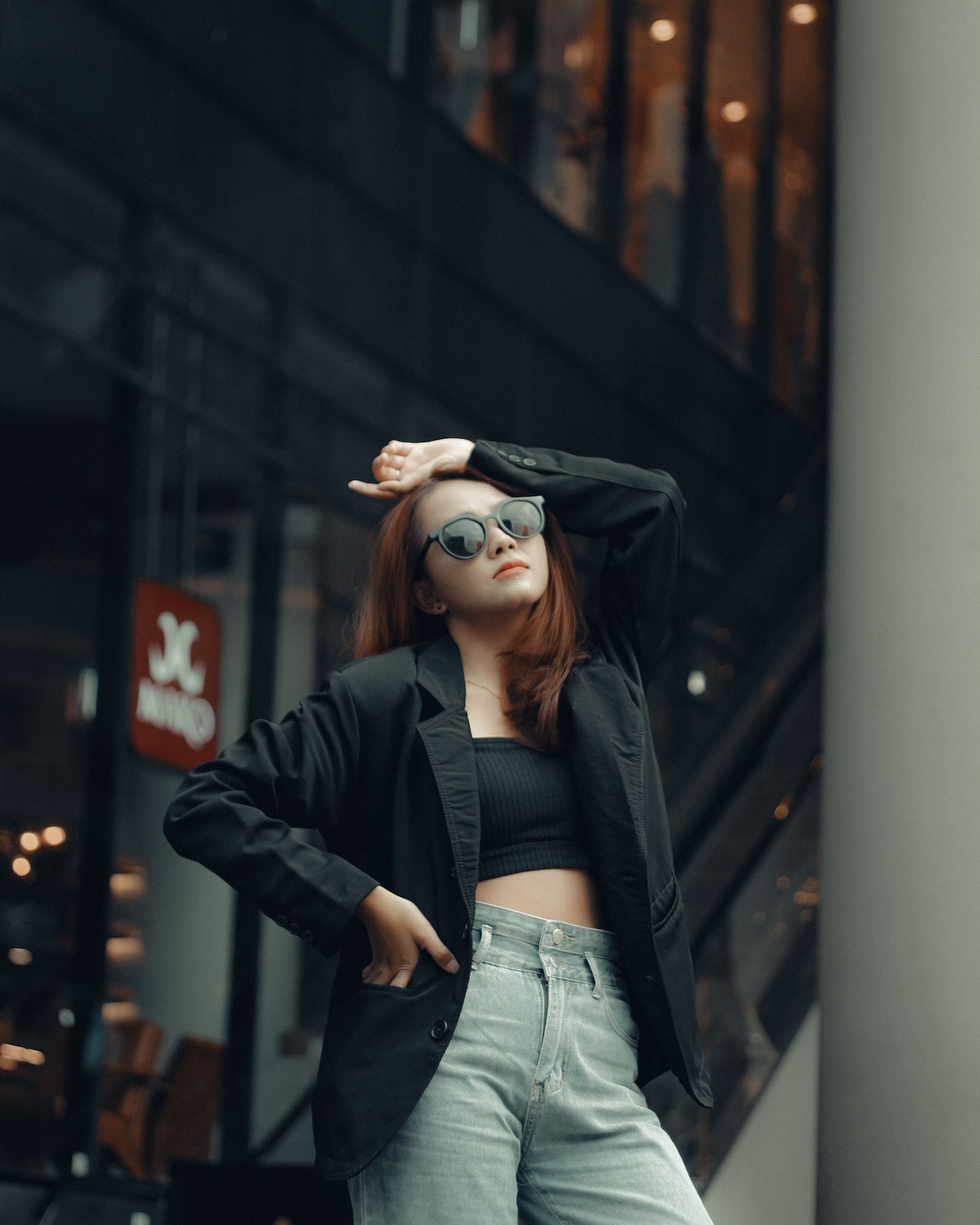 Stylish Woman Posing Outdoors in Fashionable Attire · Free Stock Photo
