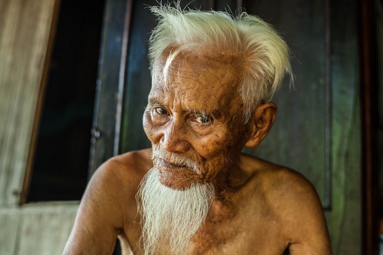 A Gray-Haired Old Man Without A Shirt