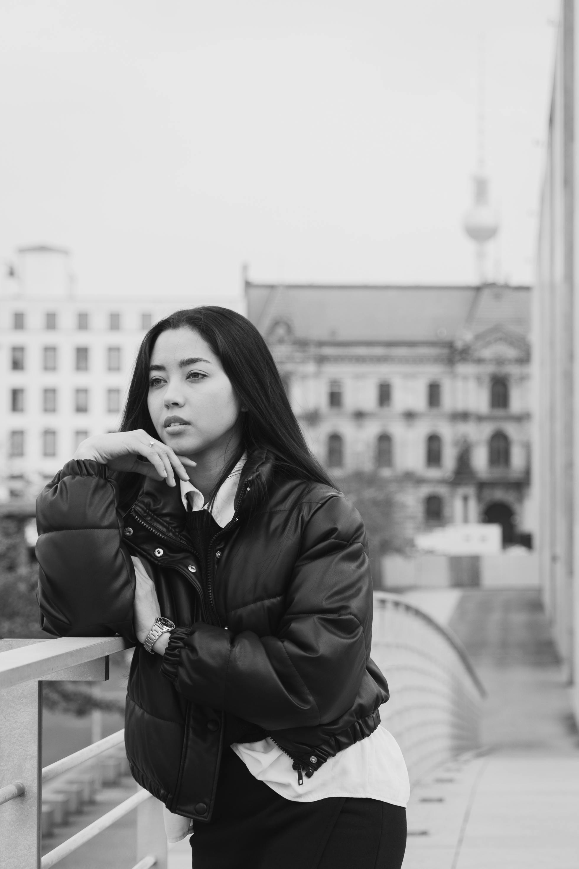 black and white portrait of woman in urban setting