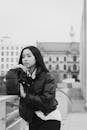 Black and White Portrait of Woman in Urban Setting