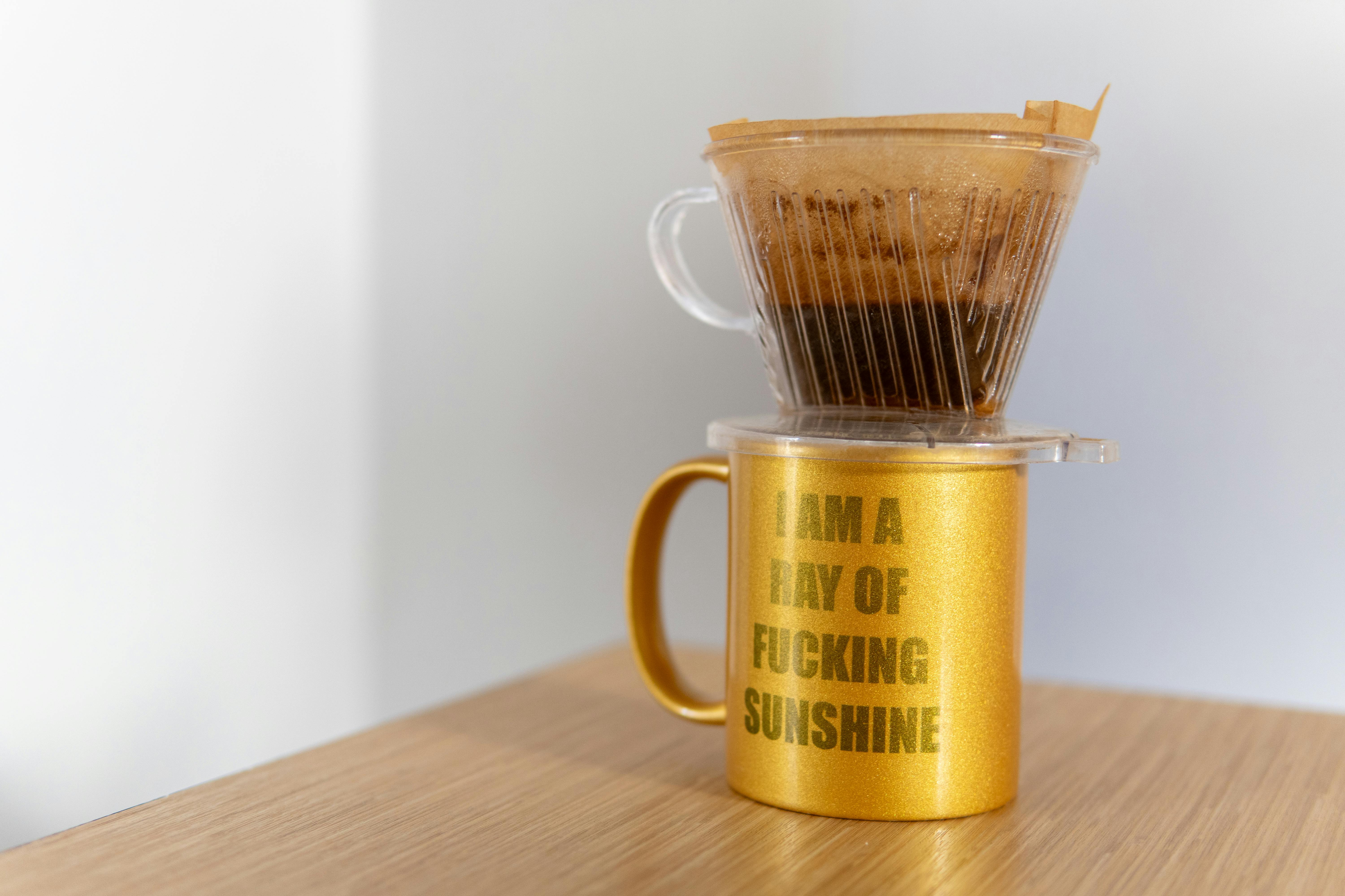 golden cup with coffee filter pour over brewing