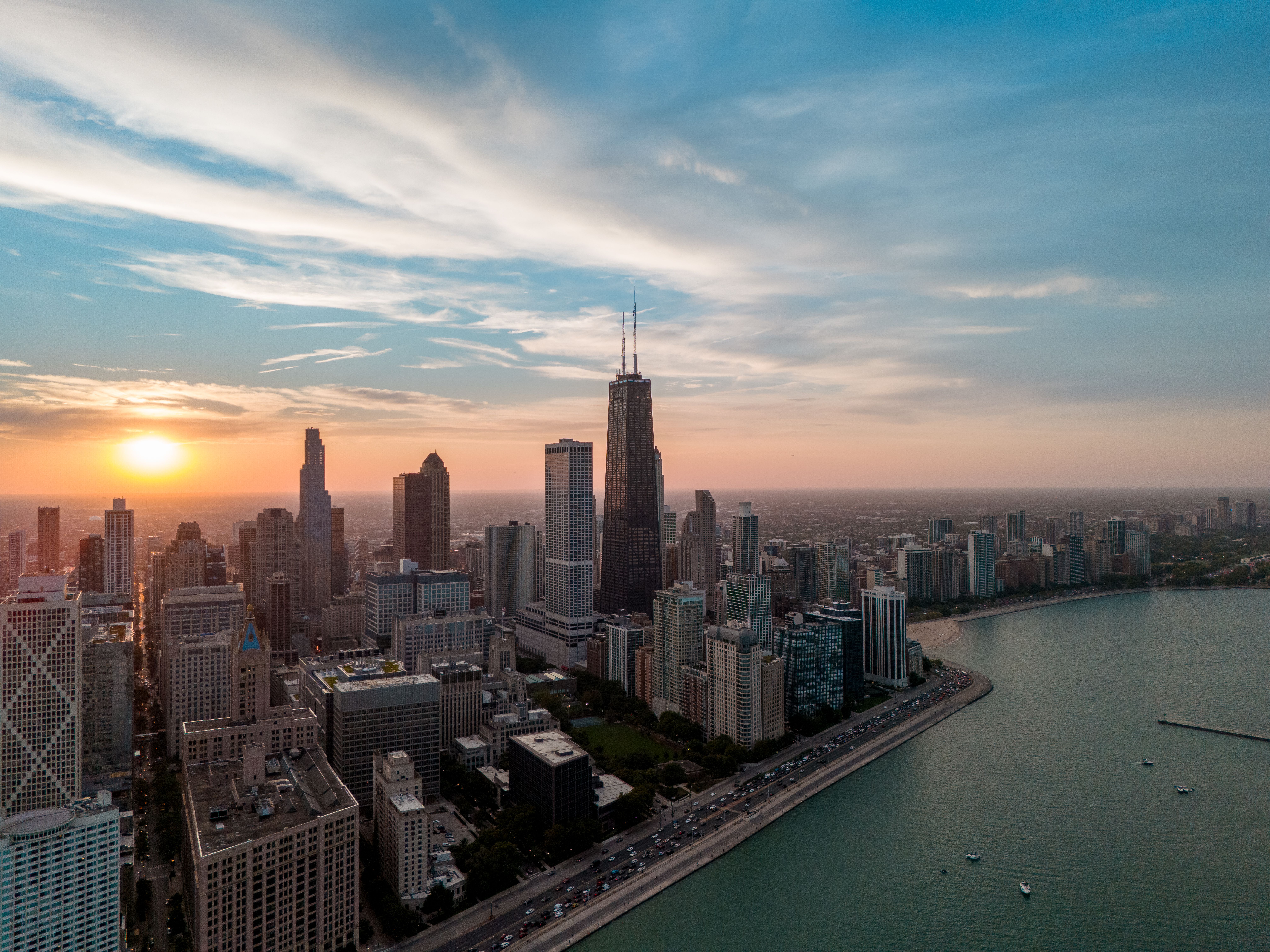 Chicago Skyline at Sunset over Lake Michigan · Free Stock Photo