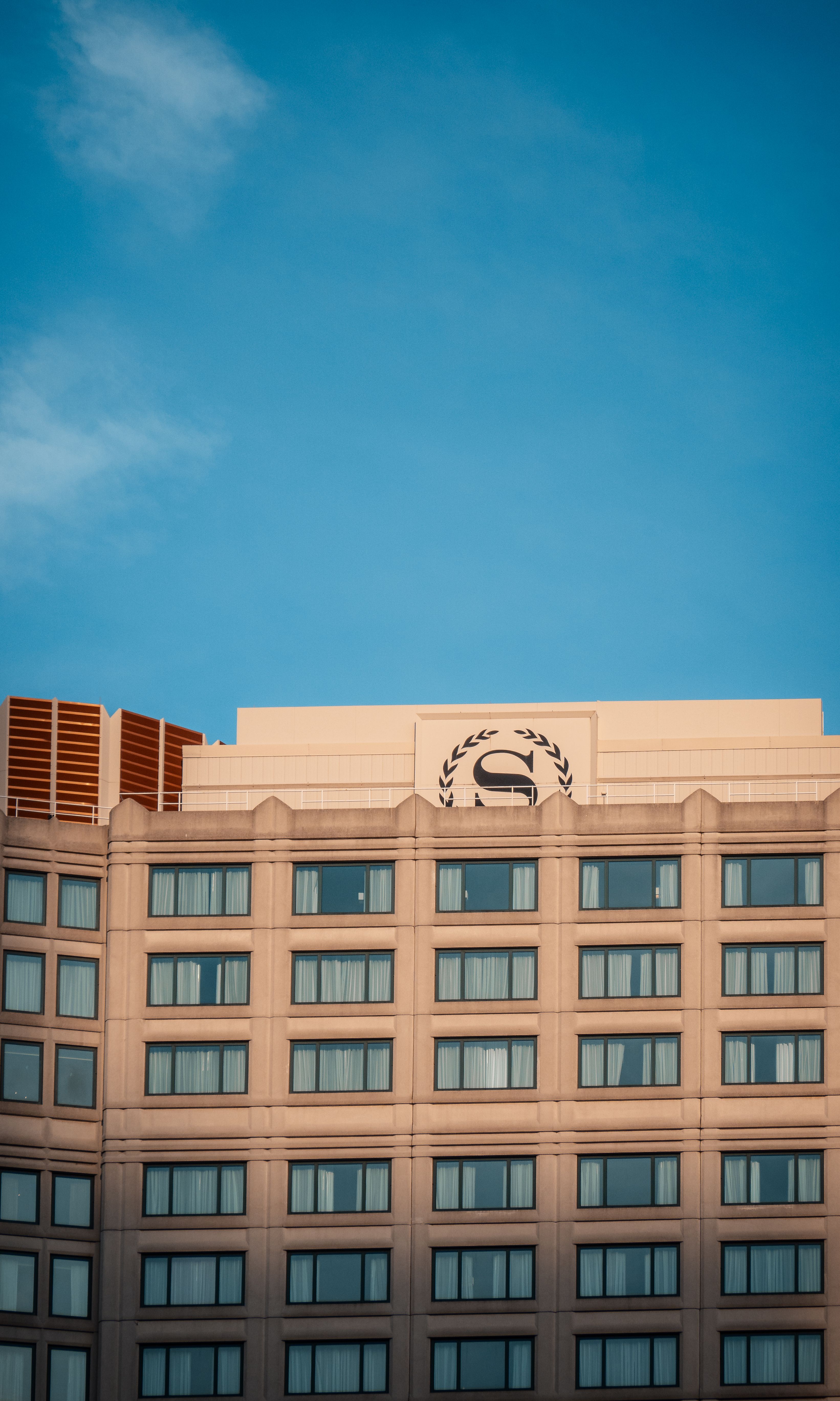 High-rise Hotel Building Against Blue Sky · Free Stock Photo