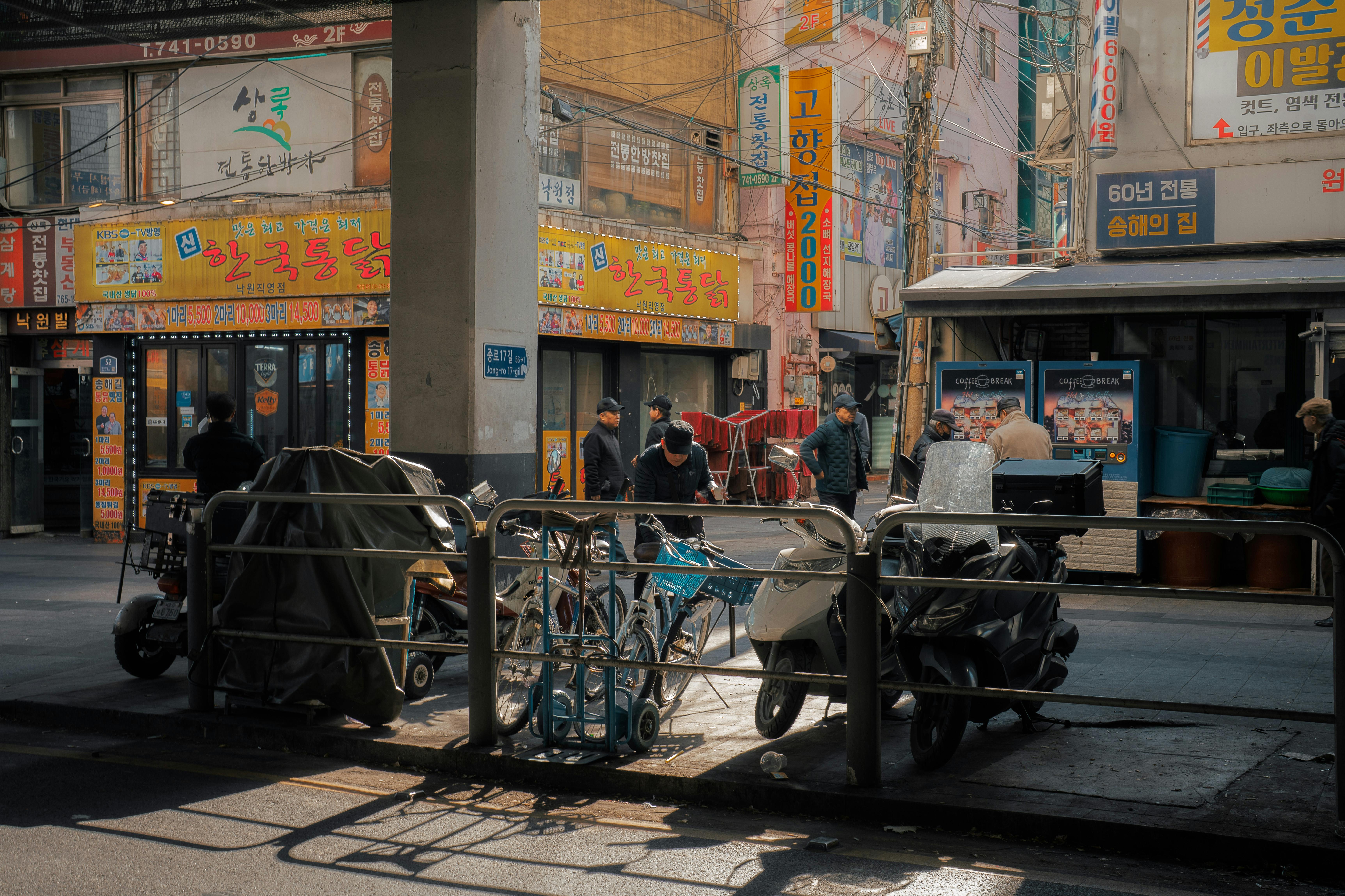 Busy street scene in Seoul, South Korea, showcasing vendors and vibrant signage.