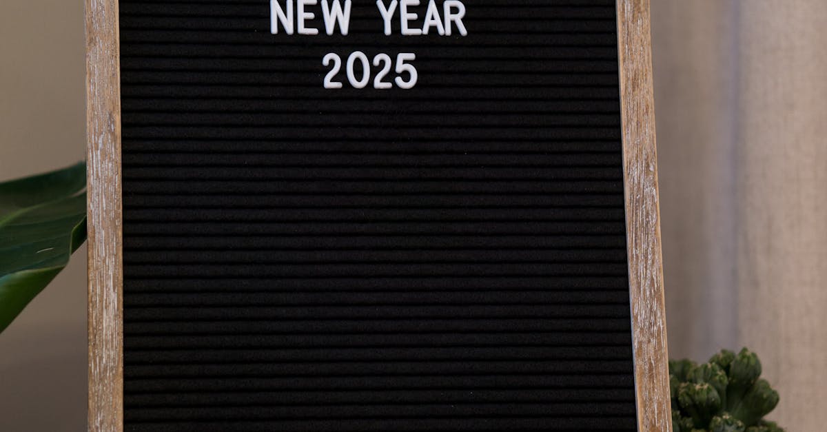Festive message board with 'Happy New Year 2025' text displayed indoors.