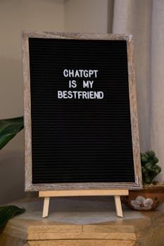 A wooden framed sign displaying the text 'ChatGPT is my bestfriend' on a black background.