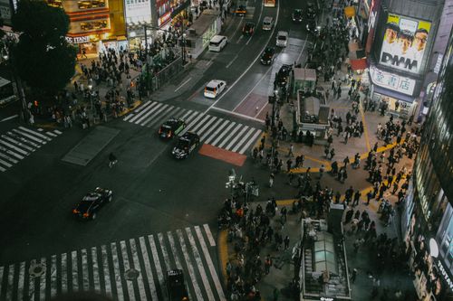 Free Bustling aerial view of Shibuya Crossing in Tokyo, showcasing vibrant nightlife. Stock Photo