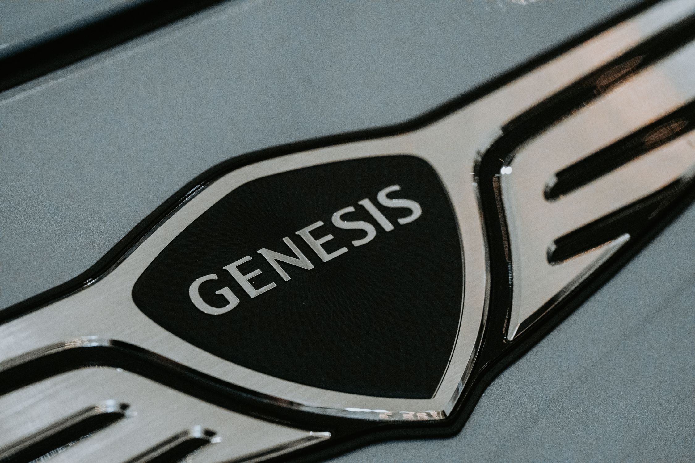 Genesis Router Logo Close-up of Genesis Car Logo Emblem · Free Stock Photo