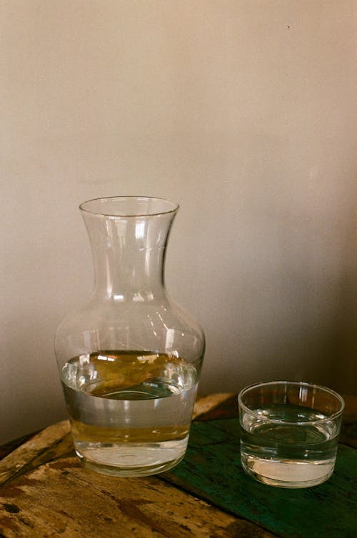Free Clear Glass Pitcher With Water Beside A Glass Stock Photo