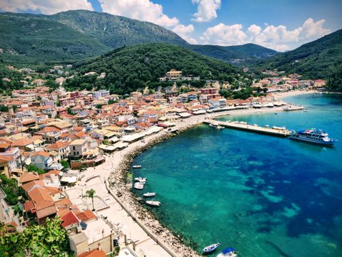 Free Stunning aerial view of Parga's vibrant coastline with clear blue waters and charming architecture in Greece. Stock Photo