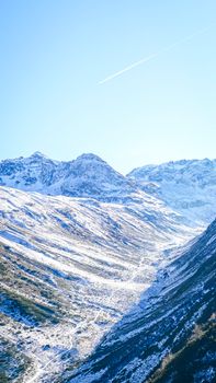 Stunning alpine winter view showcasing pristine snow-covered peaks under a clear blue sky.