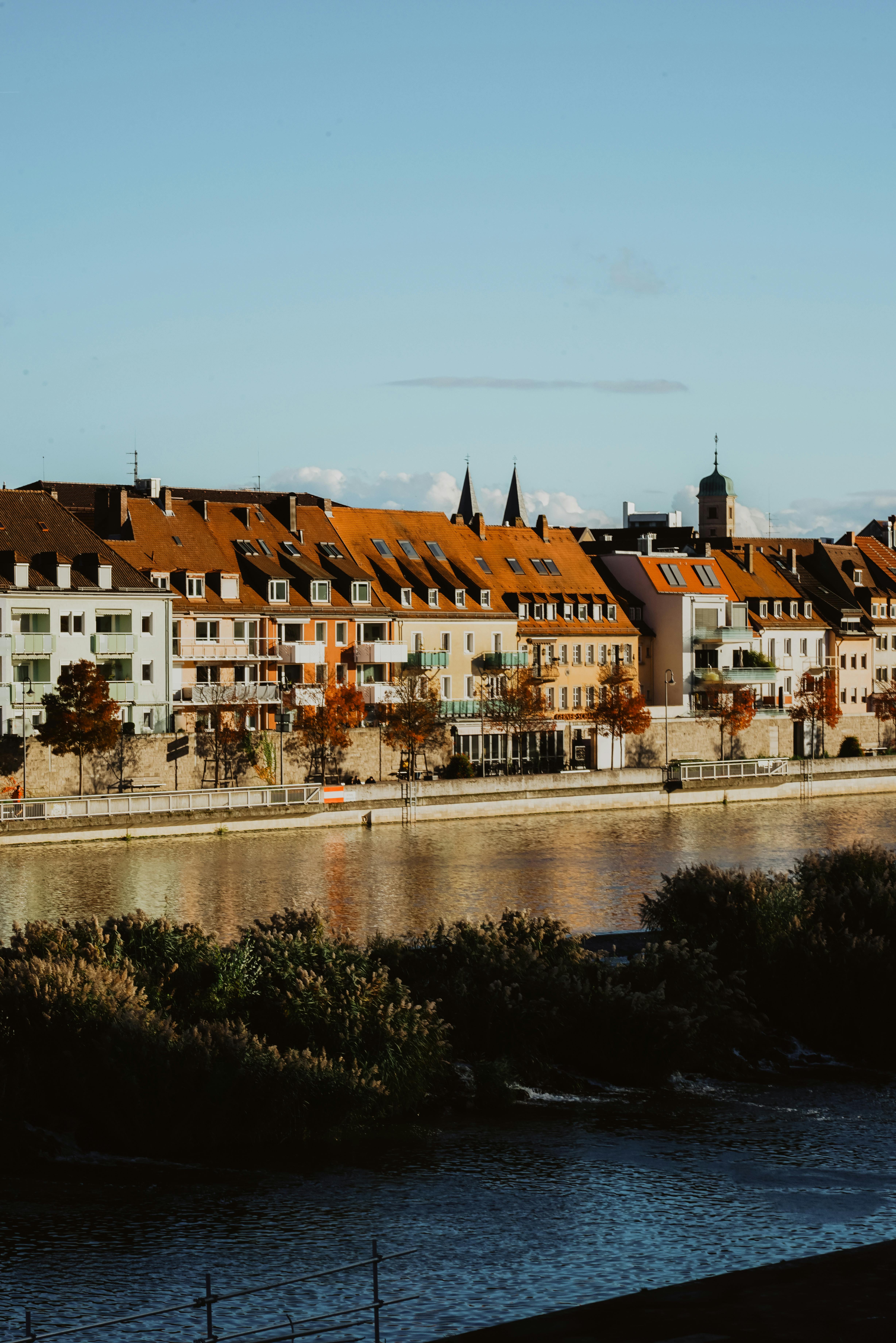 scenic autumn view of wurzburg alongside main river