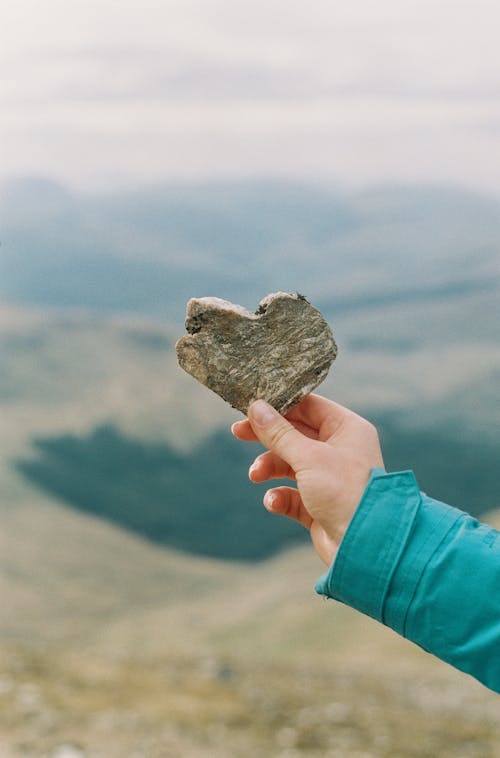 Free Person Holding a Stone Stock Photo