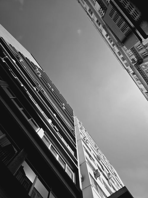 Free Dramatic view of urban high-rise buildings in black and white. Stock Photo