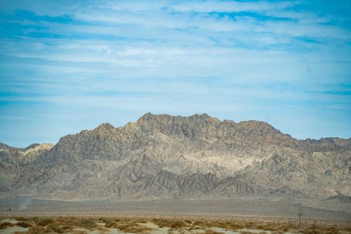 Free Stunning mountain landscape with clear blue sky, showcasing natural beauty and rugged terrain. Stock Photo