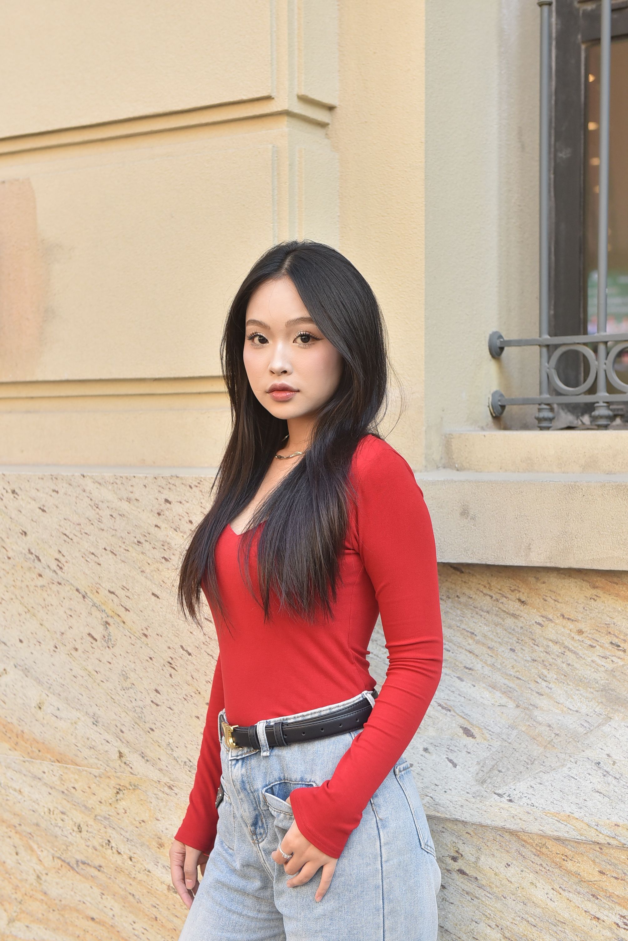 Young Woman in Red Top Posing Outdoors · Free Stock Photo