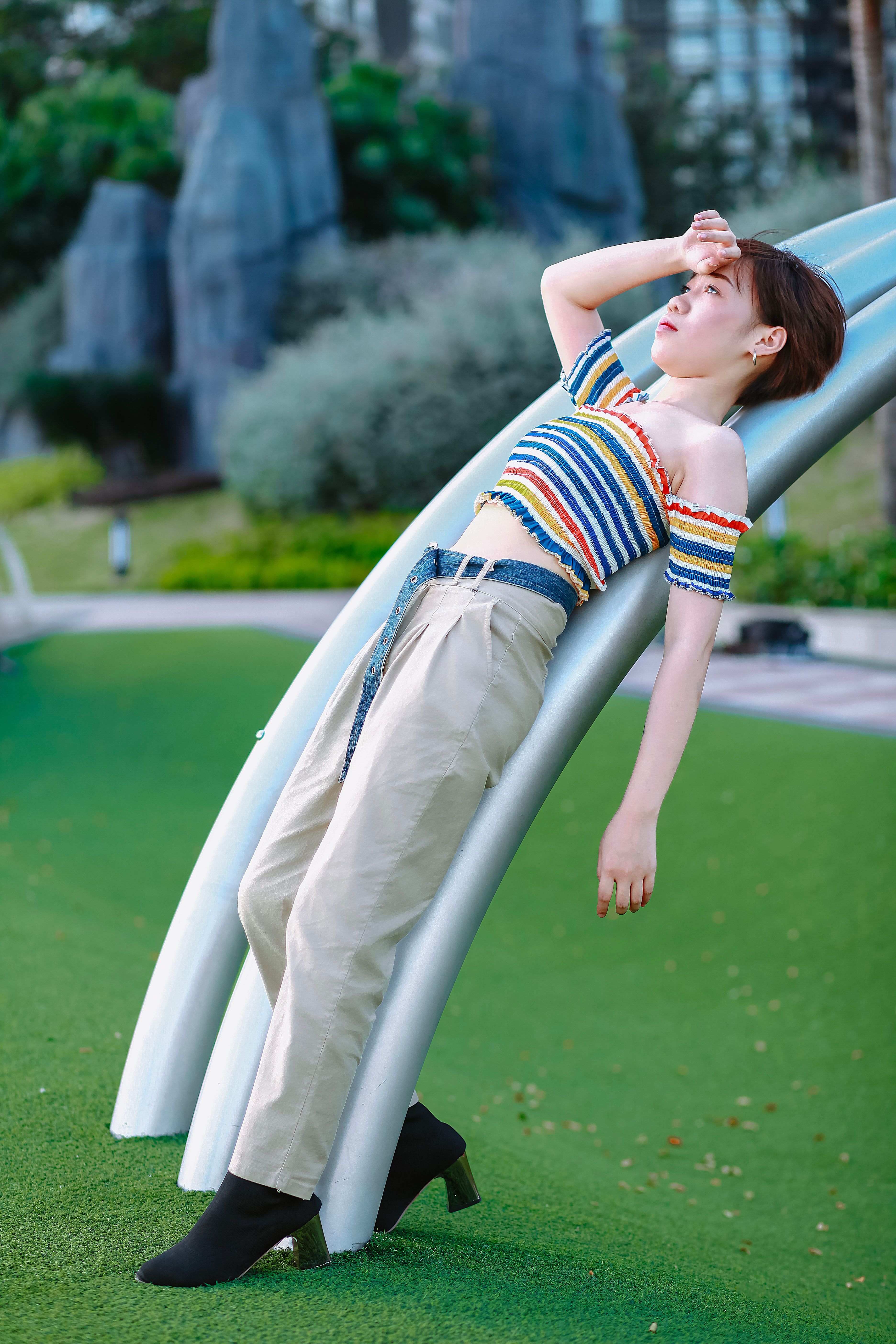 Fashionable Woman Relaxing in Urban Park Setting · Free Stock Photo