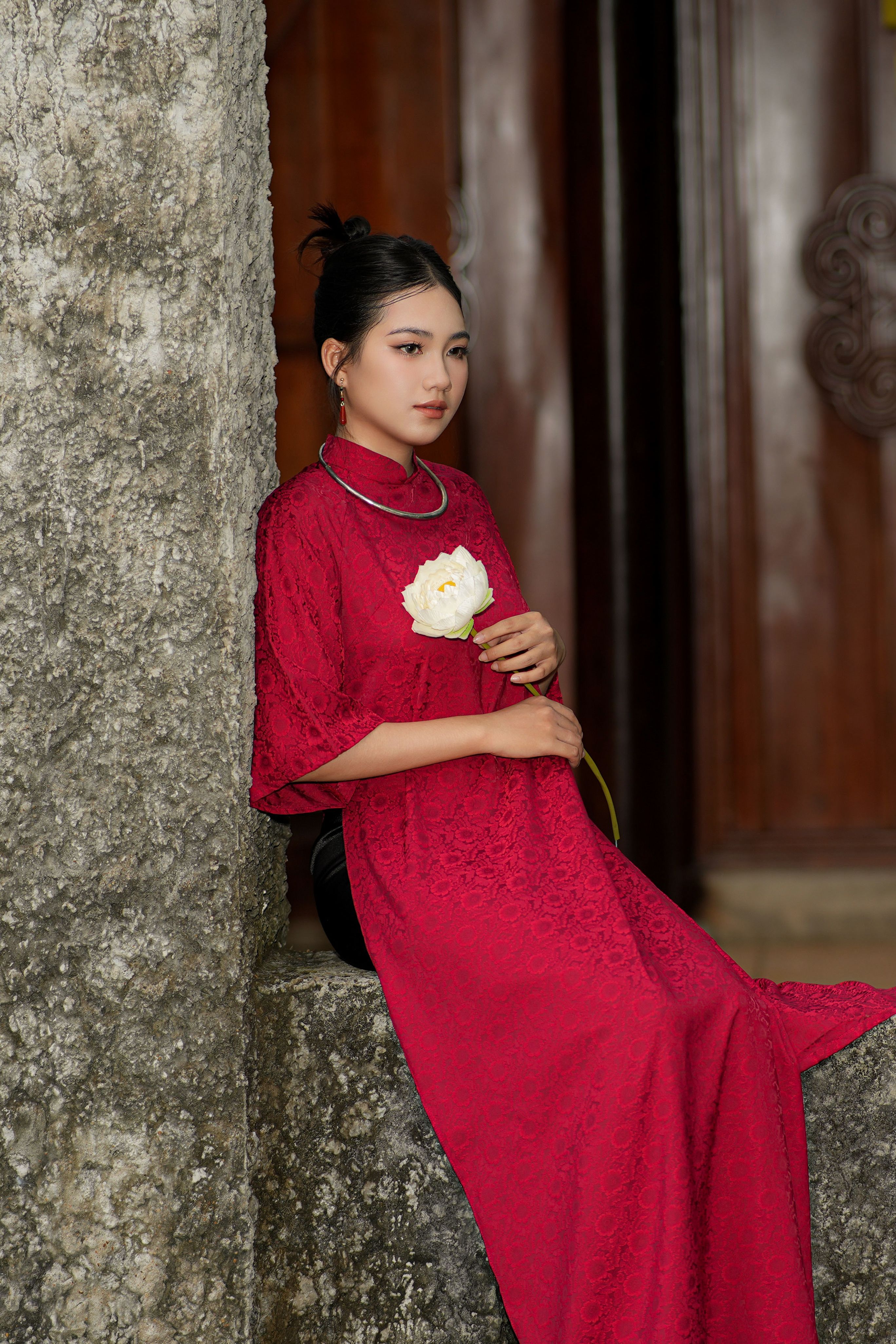 Elegant Woman in Red Dress Holding Flower · Free Stock Photo
