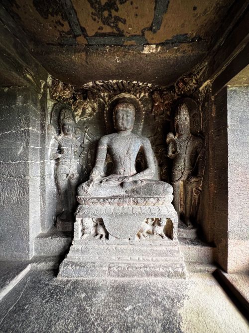 Free Intricate stone sculptures of Buddha inside a historic cave in India. Stock Photo