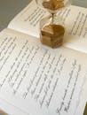 Hourglass on Book with Autumn and Winter Poetry